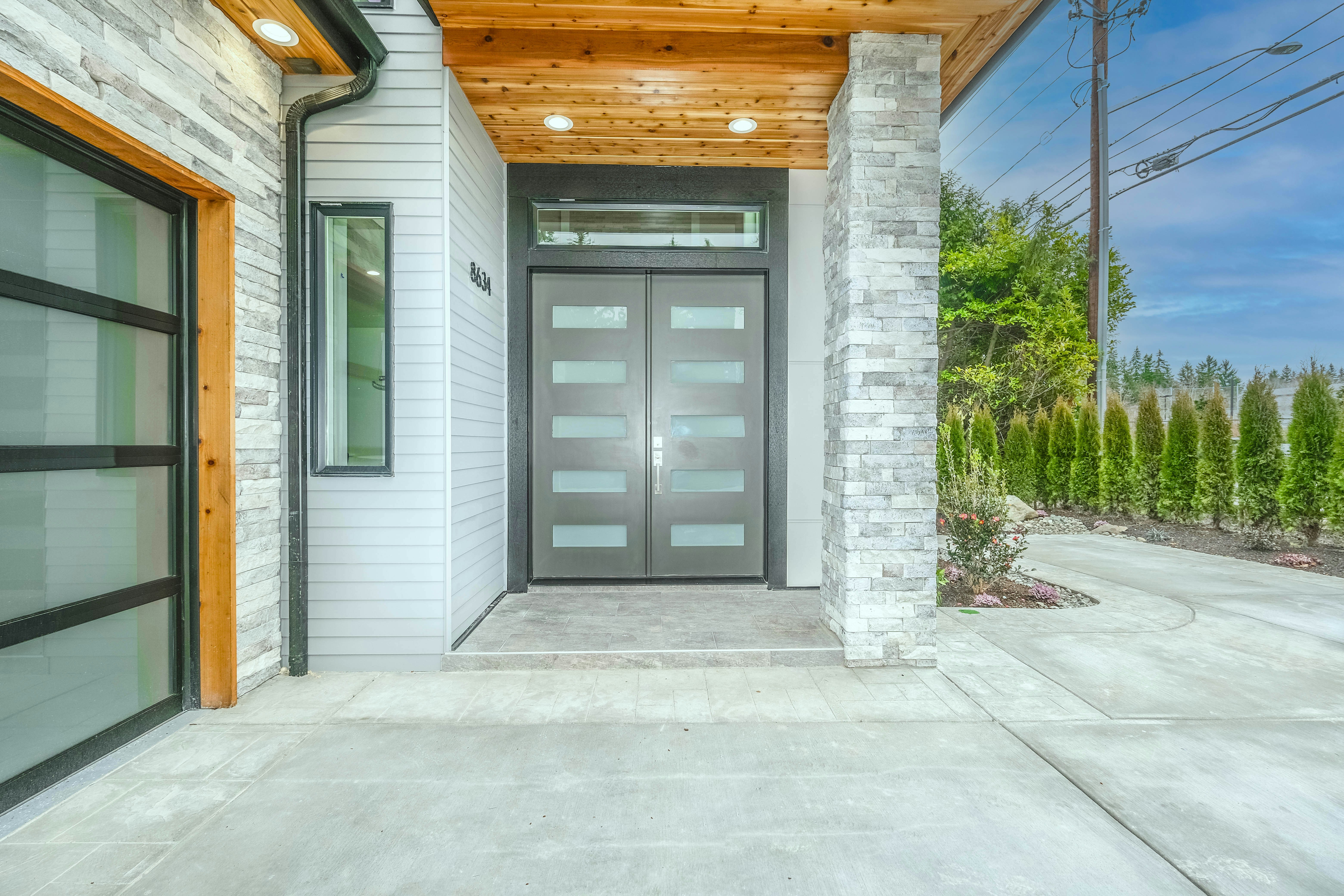Modern Austin home entrance featuring frosted glass door panels - smart glass alternative to traditional windows providing both style and privacy